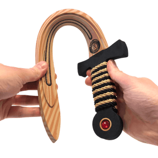 Liontouch Sword - WoodyLion: Gold/Black
Wooden and black dog toy with a red center held by two hands on a transparent background
