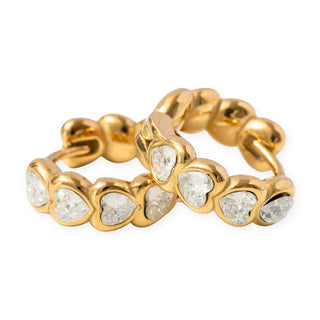 Pip Pop Post Earrings - Heart Gem Hoop Diamond
A gold ring featuring a continuous row of heart-shaped clear gemstones in a bezel setting, photographed on a clean white background.