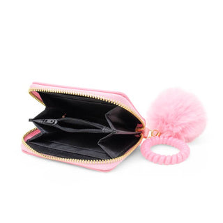 Zomi Gems 3D Bow Pom Pom Zip Wallet - Pink
Pink pouch with a black interior and a pink hair tie on a white background