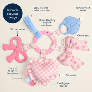Itzy Ritzy Bow Bitzy Busy Ring activity toy for babies with colorful rings and a bow design for sensory play and teething.