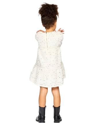 Baby Sara Tiered Dress with Sequin Bow Detail
Person wearing a white dress with black polka dots on a light gray background