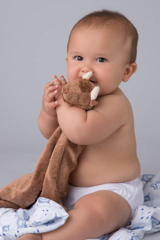 Angel Dear Blankie - Bison Baby holding a brown plush toy against a gray background