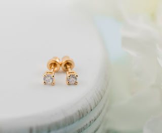 Cherished Moments Kids 14K gold clear CZ earrings with screw back closures, featuring sparkling cubic zirconia stones.
