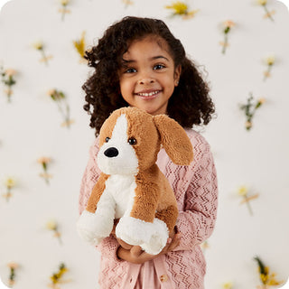 Beagle Warmies
Child holding a plush dog toy against a light background
