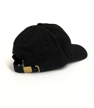 Black Dad Brand boy hat shown from side view, casual cap with curved brim and adjustable strap for kids.