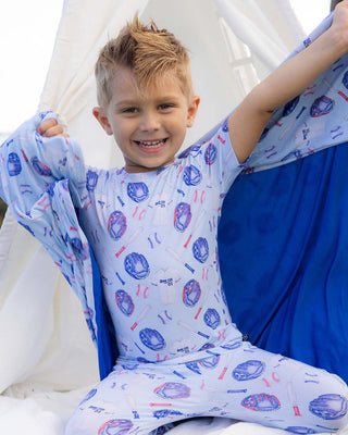 Lev Baby pajama set with home run baseball print, featuring soft fabric and cozy design for infants and toddlers.