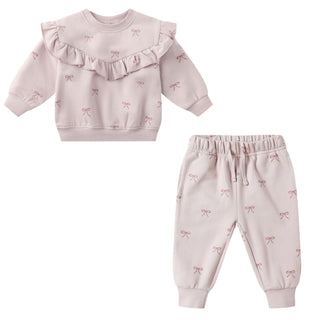 Quincy Mae Relaxed Fleece Sweatshirt & Relaxed Fleece Sweatpant Set - Bows
Pink baby outfit with ruffled top and bow patterned pants on a white background