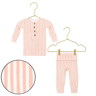 Lou Lou and Company Top and Bottoms - Brynn
Pink and white striped baby outfit with shirt and pants on hangers against a white background.