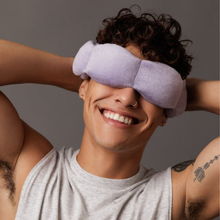 Noppod Weighted Sleep Eye Mask - Wisteria
Person wearing a purple sleep mask with a neutral background