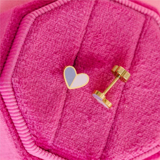 Pierced Co. Heart Duo Earrings
Heart-shaped earrings on a pink textured surface