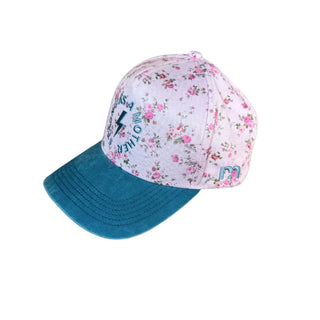 Strong As A Mother® Canvas Hat - Floral
Cap with floral pattern on top and blue brim on a light gray background