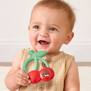 Itzy Ritzy Bitzy Shake silicone teether with rattle in cherry design, soft and colorful teether for babies.