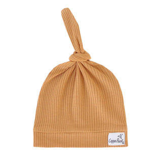 Copper Pearl Rib Knit Top Knot Hat in copper color, soft knit fabric, designed for babies or toddlers.