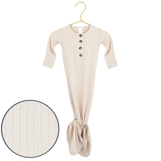 Lou Lou and Company Ribbed Knotted Gown - Cove
Beige baby onesie with buttons on a hanger against a white background