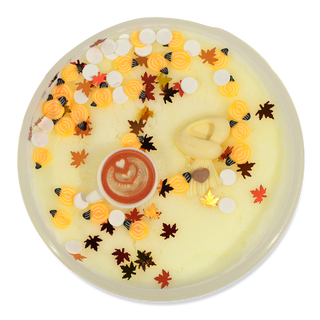 Peachybbies Cloud Slime - Cozy Cashmere
A round, flat-lay product shot of a pale yellow wax melt or soap with an autumn theme. The top is decorated with colorful swirls, small leaves, bee motifs, and a central coffee cup graphic.