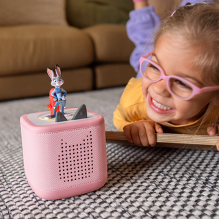 Tonies Character - Disney: Zootopia
Child playing with a pink toy speaker and figurine on a patterned rug.
