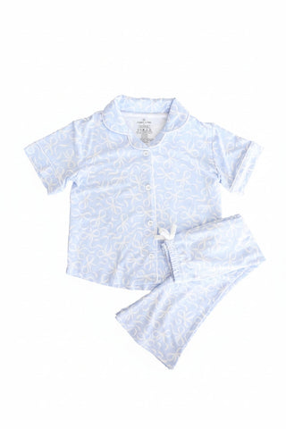 Caden Lane girl's two-piece flare lounge pajama set in blue with bows, featuring a cozy top and matching pants for comfortable sleepwear