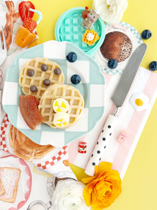 Earth Grown KidDough EGKD Sunny Side Diner KidDough Play Kit
Breakfast setting with waffles, bacon, and a knife on a colorful plate against a yellow background.