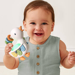 Itzy Ritzy Bitzy Tunes™ Musical Piano Toy - Goose
Baby holding a colorful toy with a white background