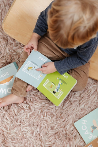 Left Hand Book House Soccer Baby board book featuring colorful illustrations of a baby playing soccer for infants and toddlers.