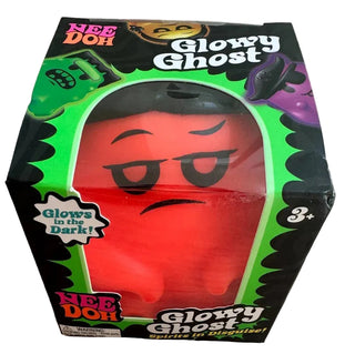 NeeDoh Needohween Glowy Ghost
A boxed toy product labeled 'Glowy Ghost' by NEE DOH, shown in its retail packaging on a wood surface. The box is black with bright green border graphics and a clear window revealing a red ghost figure inside with a sad face.