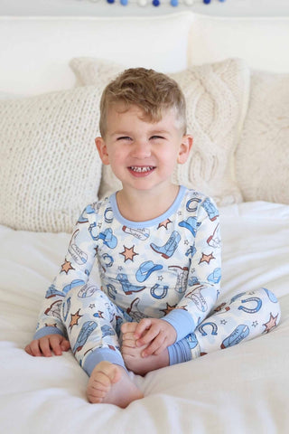 Caden Lane two-piece pajama set in Rodeo Dreams Blue featuring soft fabric and a comfortable fit for kids.