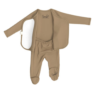 Bonsie Footie - Mocha
A baby footed one-piece swimsuit in a warm tan color, featuring a long-sleeve rash guard top, matching footed pants, and a white neoprene flip-up hood. The brand name 'Bonafide' is printed on the chest and lower leg.