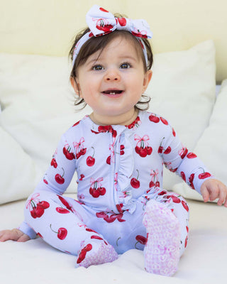 Lev Baby Ruffled Zippered Footie in Alice design, soft baby onesie with ruffles and zipper closure, ideal for comfortable infant wear.