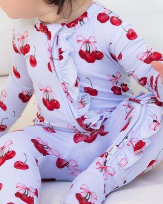 Lev Baby Ruffled Zippered Footie in Alice pattern, soft and cozy baby one-piece with ruffles and zipper closure.