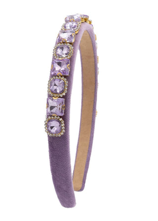 Bari Lynn Full Multi Shape Jewel Velvet Headband - Lavender
A lavender purple velvet headband decorated with a vertical row of light purple rhinestone rhombus and oval crystals set in gold-tone frames, shown on a plain white background.