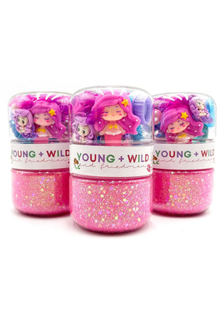 Young Wild and Friedman Grab & Go Dough Jar - Mermaid Magic
Three pink glittery containers with a character on a white background, labeled 'Young + Wild'.