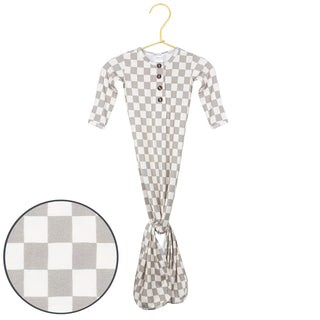 Lou Lou and Company Knotted Gown - Palmer
Checkered baby outfit on a hanger with close-up of checkered pattern.