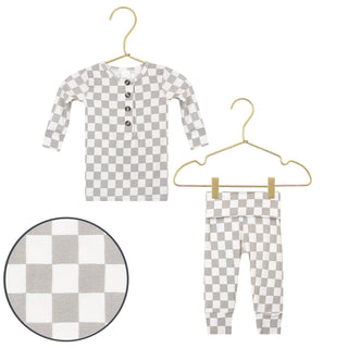 Lou Lou and Company Top and Bottoms - Palmer
Checkered baby outfit with shirt and pants on hangers against a white background