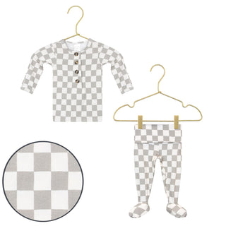 Lou Lou and Company Top and Bottoms - Palmer
Checkered children's shirt and leggings set on hangers with a close-up of the checkered pattern.