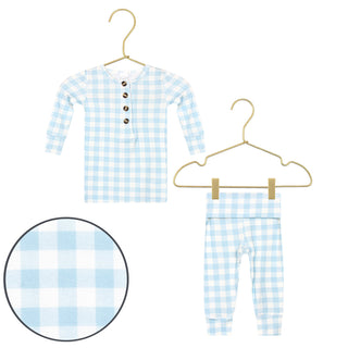 Lou Lou and Company Knit Top and Bottoms - Walker
Blue and white checkered children's outfit on hangers with a close-up of the fabric pattern.