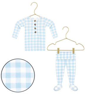 Lou Lou and Company Knit Top and Bottoms - Walker
Blue and white checkered baby outfit with buttons on a hanger against a white background.