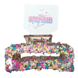 American Jewel Funfety Claw Clip - Bows
Colorful butterfly hair clip with 'American Jewel' packaging on a white background