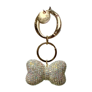 Clear AB  Rhinestone Bag Charm / Keychain - Bow Gold keychain with a silver bow-shaped charm on a white background