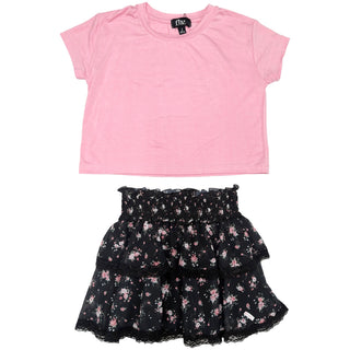 FBZ Black & Pink Floral Lace Trim Skirt A two-piece girls' outfit set featuring a light pink short-sleeve crop top and a black tiered ruffle skirt with a pink and white floral pattern and lace trim, displayed flat on a white background.