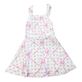 White floral dress with pink bow and heart design from Flowers By Zoe, perfect for girls' special occasions.