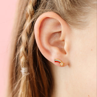 Pip Pop Post Earrings - Shooting Star
Close-up of an ear wearing a rainbow-shaped earring with a pink background