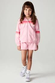 Chaser Multi Stripes Girls Zip Up
Chaser Multi Stripes Girls Shorts
Child wearing a pink tracksuit with red stripes on a white background