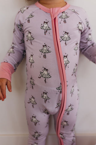 In My Jammers Ballerina Ghost Zipper Romper Child wearing a purple onesie with black and white patterns on a plain background
