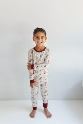 In My Jammers Bear-y Merry Two Piece Set
Child wearing a pajama set with a white background