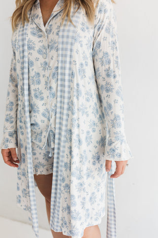 In My Jammers Blue Rose Garden Women's Robe
Woman wearing a blue floral and checkered robe on a white background