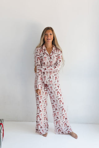 In My Jammers Merry Little Bows Women’s Set
Woman wearing a patterned pajama set on a white background
