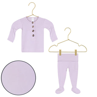 Lou Lou and Company Top and Bottoms - Isabelle
Lavender baby outfit with shirt and tights on hangers against a white background