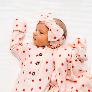 Lou Lou and Company Junie strawberry knit headband with bow for babies and toddlers, soft and cozy accessory.