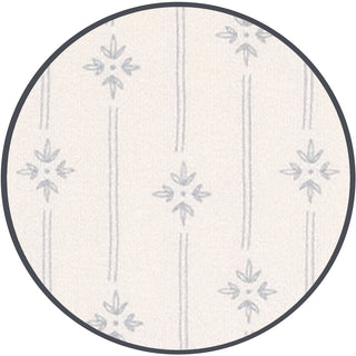 Lou Lou and Company Kit
Round rug with subtle pattern on a white background