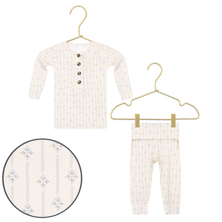 Lou Lou and Company Top and Bottoms - Kit
Baby outfit with long-sleeve top and pants on hangers against a white background